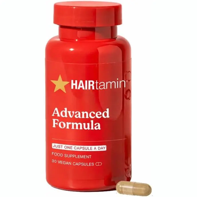 Front view of HAIRtamin Advanced Formula red bottle with single vegan capsule
