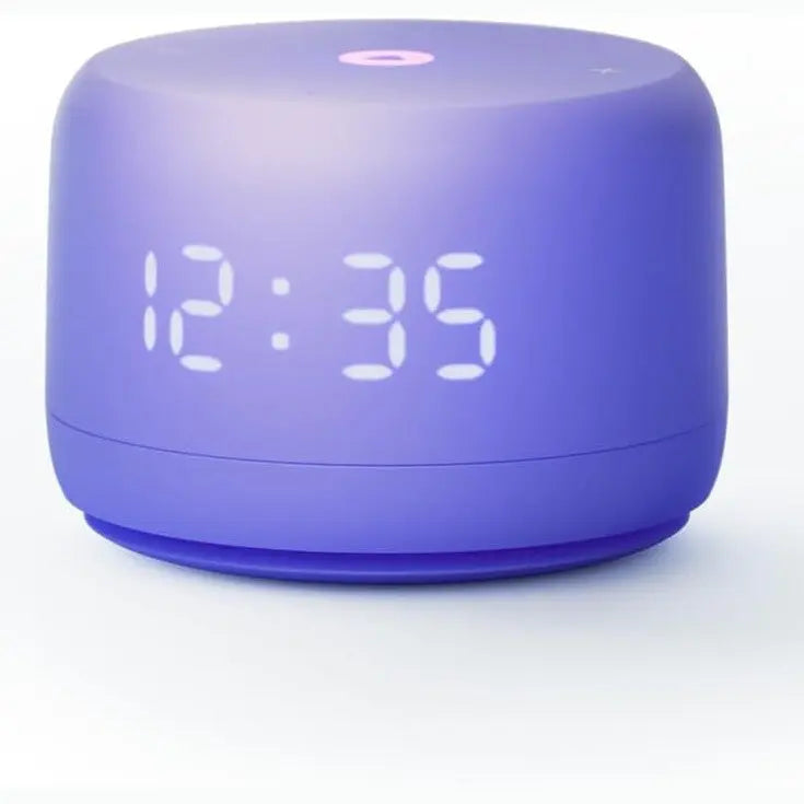 Purple cylindrical Yasmina Lite smart speaker showing digital clock display on white background
