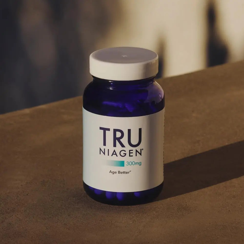 TRU NIAGEN 300mg cobalt blue glass bottle showing visible white vegetarian capsules inside