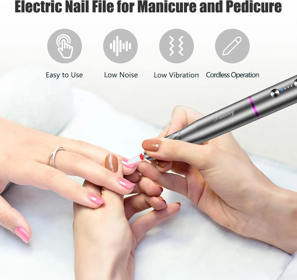 Person using gray Dannary cordless electric nail file for gentle manicure on light pink nails