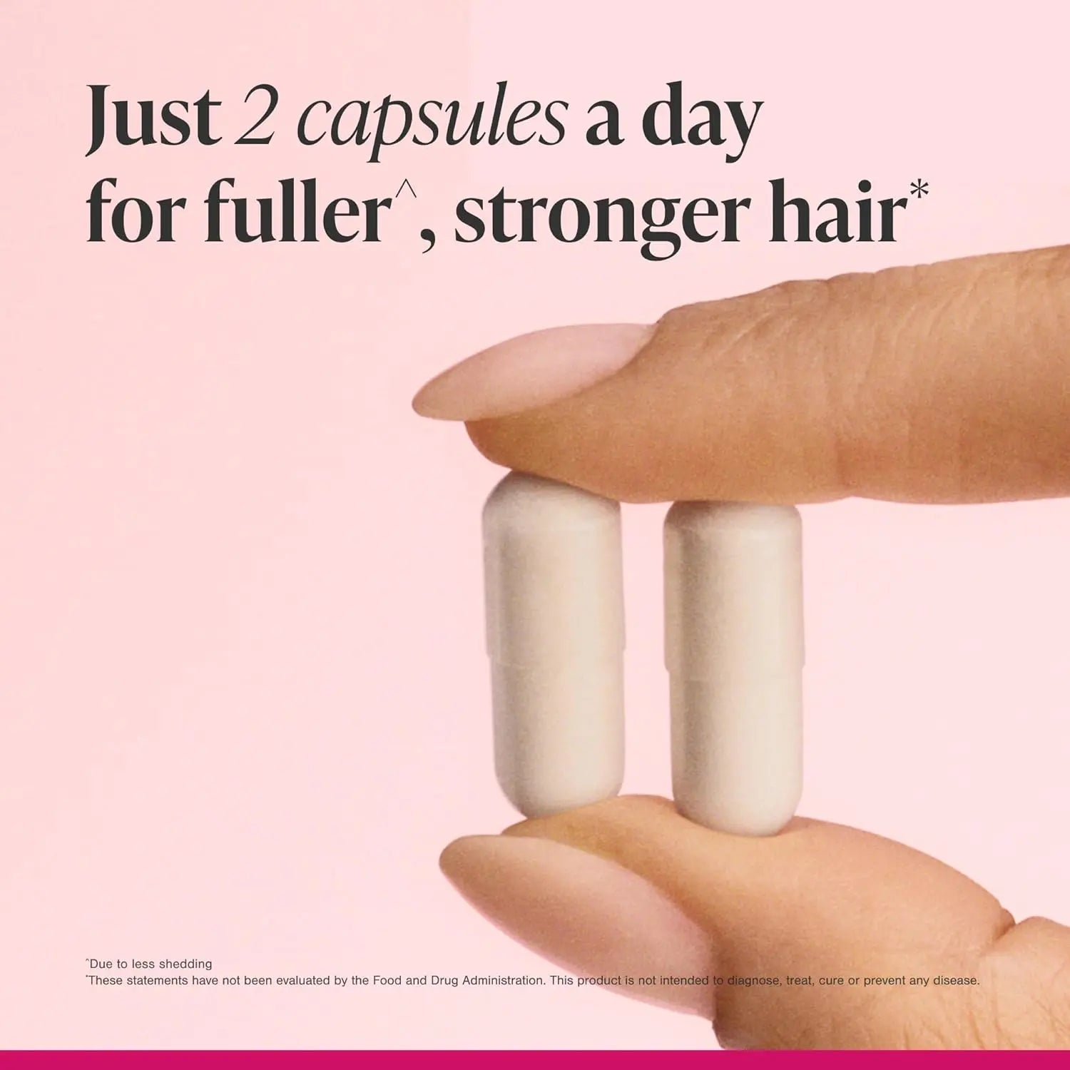 Two light beige oval Viviscal hair vitamins held in hand for daily fuller stronger hair support