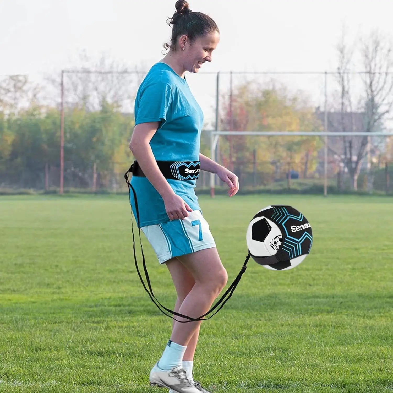 Woman using Senston adjustable soccer training belt on field