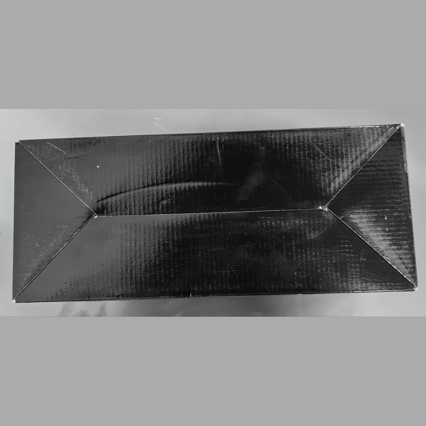 Back view of matte black corrugated cardboard shipping box for AKONE speaker