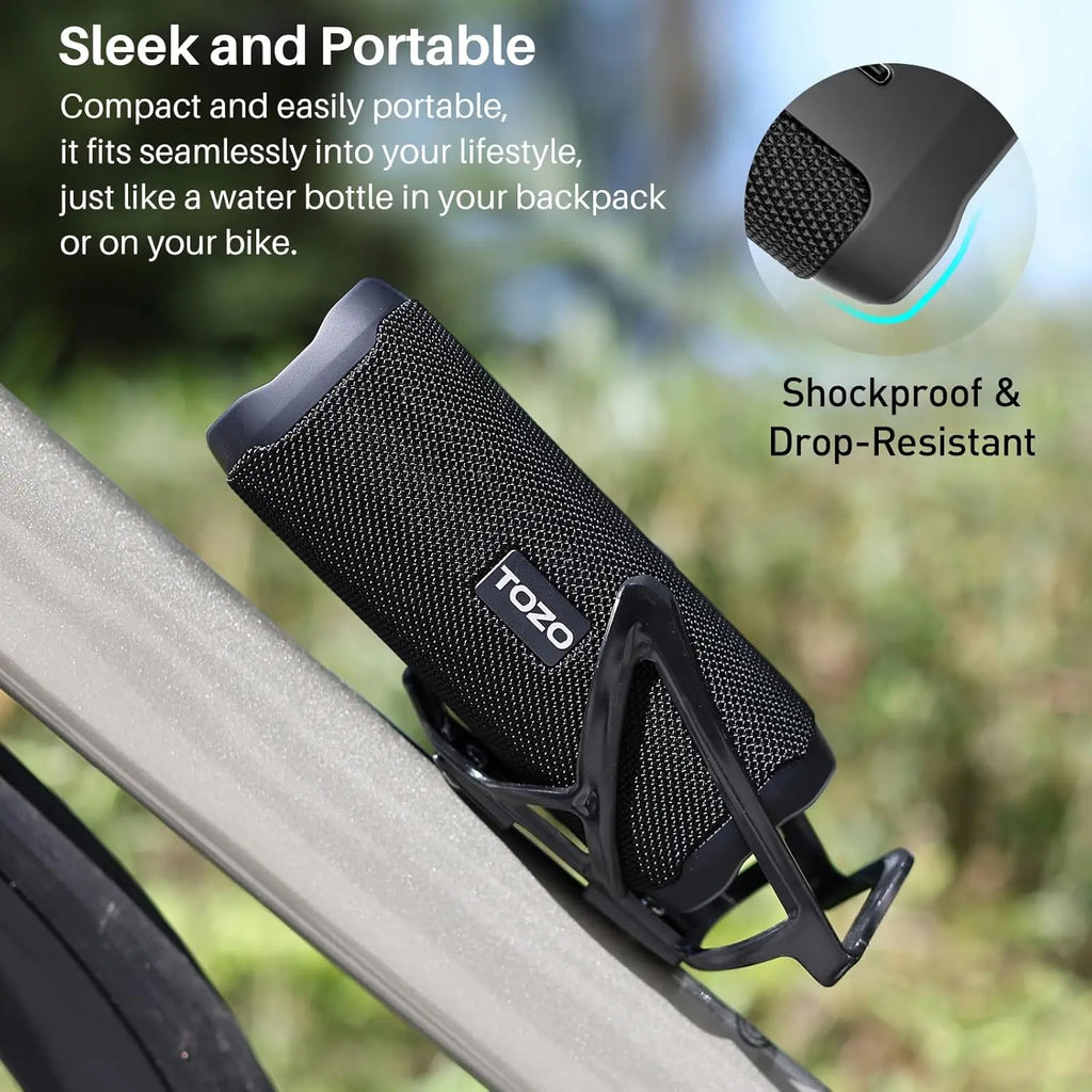 Shockproof black TOZO speaker mounted in bicycle bottle cage